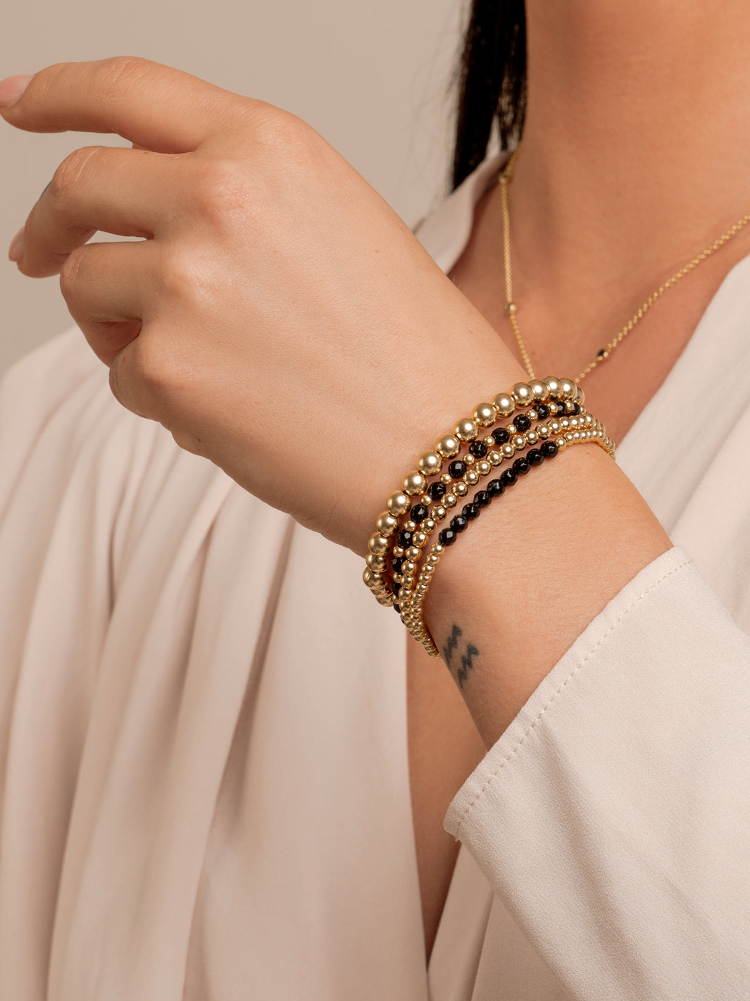 Onyx Saturn Mix Armbanden Stack | Goudkleurig