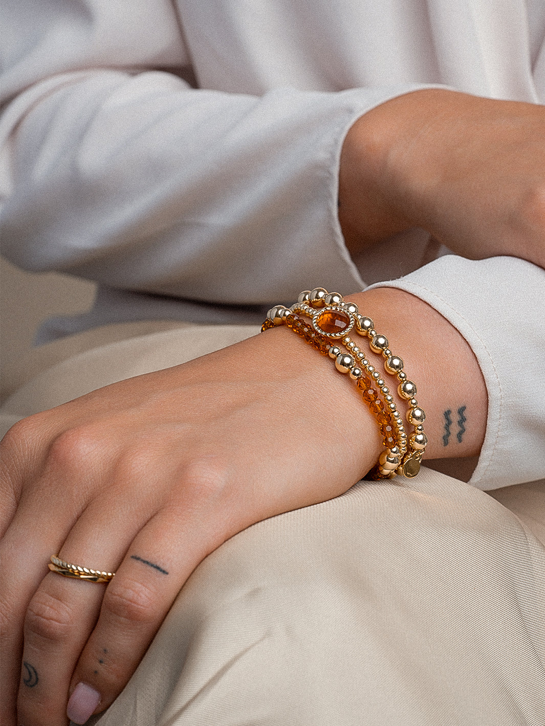 dames armband met oranje edelsteen kralen #kleur_goud