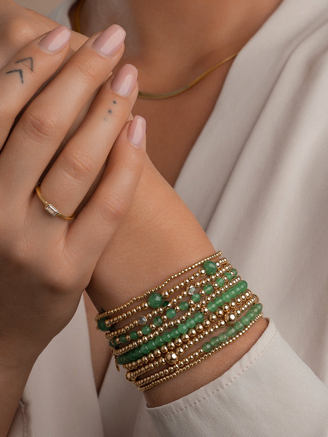 gouden damesarmband met groene aventurijn edelstenen 